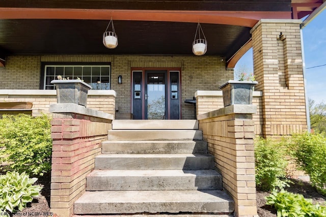 1042 Fort Martin Rd, Maidsville, WV 26541 - doorway to property featuring covered porch and brick siding