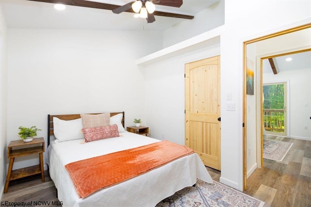 bedroom with wood finished floors, ceiling fan, recessed lighting, and vaulted ceiling with beams