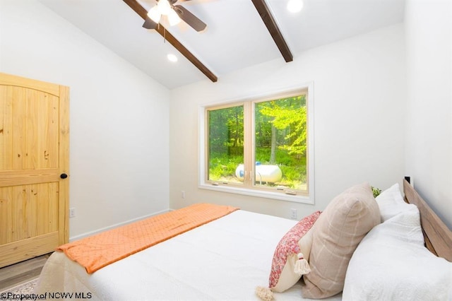 bedroom featuring wood finished floors, lofted ceiling with beams, recessed lighting, and a ceiling fan