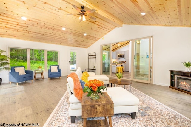 living area featuring recessed lighting, wood finished floors, vaulted ceiling with beams, and wood ceiling