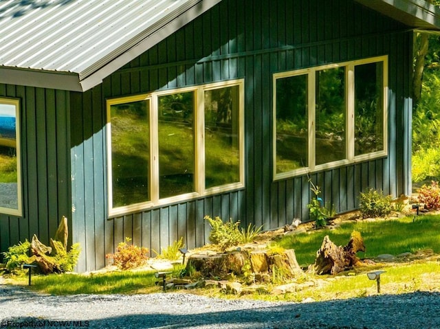 view of home's exterior featuring board and batten siding and metal roof