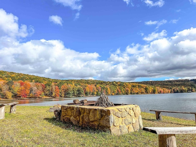 exterior space featuring a water view and a view of trees