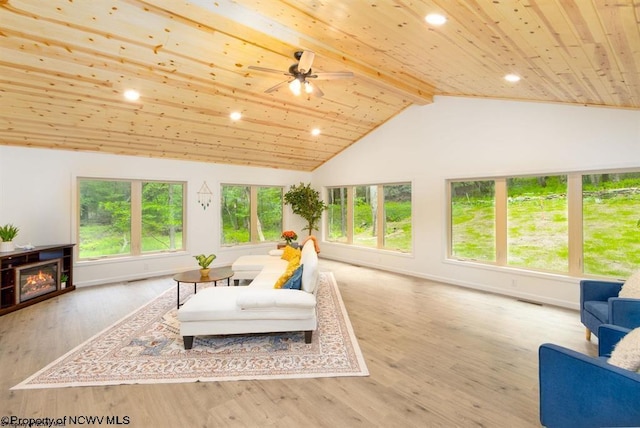 sunroom / solarium featuring beamed ceiling, visible vents, and a healthy amount of sunlight