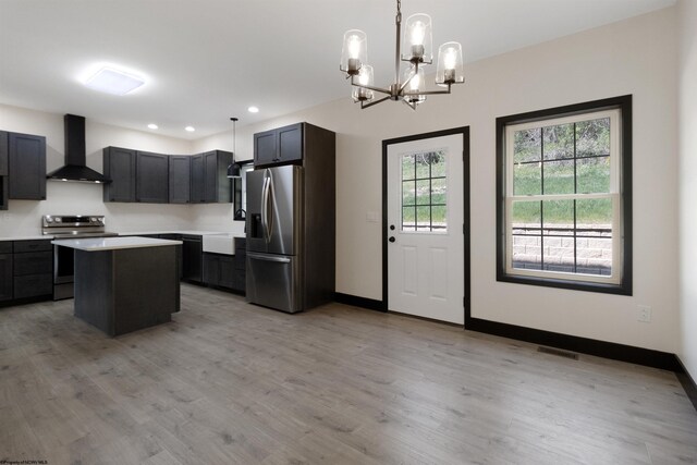 69 Hall Valley Ct, Bridgeport, WV 26330 - kitchen with light wood finished floors, visible vents, wall chimney range hood, light countertops, and appliances with stainless steel finishes
