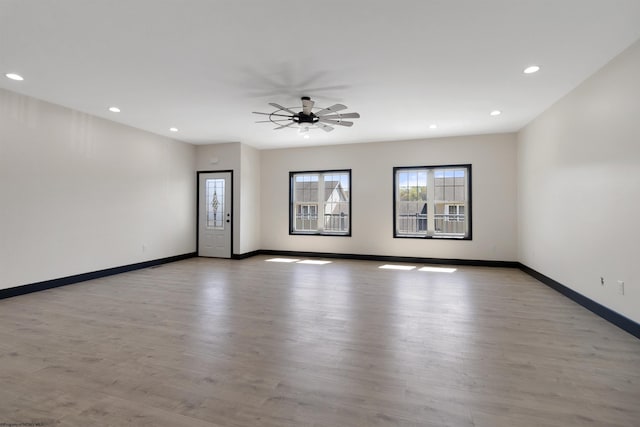 69 Hall Valley Ct, Bridgeport, WV 26330 - spare room featuring baseboards, a ceiling fan, a wealth of natural light, and light wood finished floors