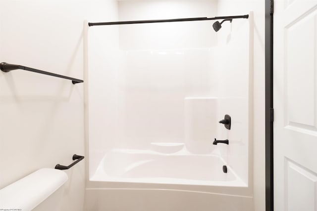 bathroom with toilet and tub / shower combination