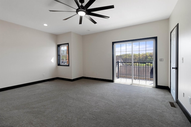 unfurnished room featuring visible vents, a ceiling fan, a healthy amount of sunlight, and light colored carpet