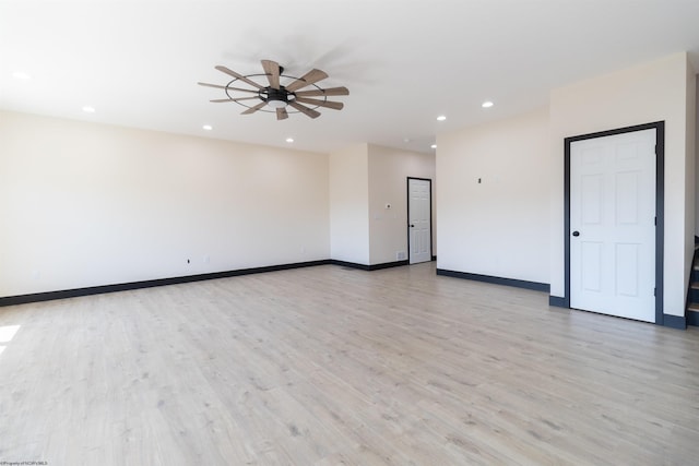 empty room featuring recessed lighting, a ceiling fan, baseboards, and light wood-style floors