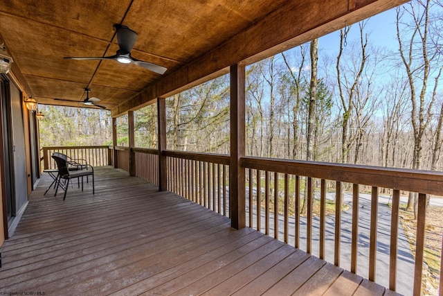 wooden terrace featuring a ceiling fan