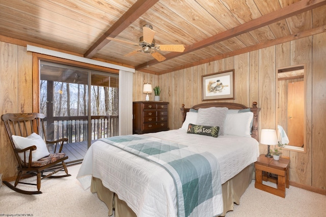 carpeted bedroom featuring beamed ceiling, wooden ceiling, ceiling fan, wooden walls, and access to exterior