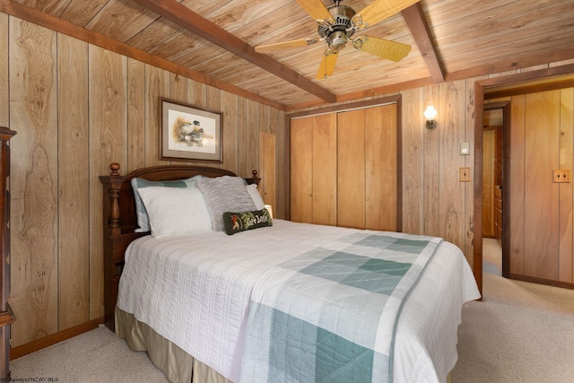 bedroom featuring carpet floors, wooden walls, and wooden ceiling