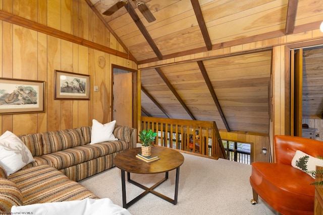 carpeted living area with wooden walls, lofted ceiling with beams, a ceiling fan, and wooden ceiling