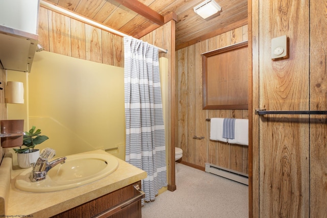 bathroom featuring a baseboard heating unit, toilet, vanity, curtained shower, and wooden walls