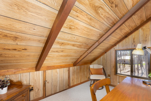 home office with wooden walls, carpet flooring, wooden ceiling, and vaulted ceiling with beams
