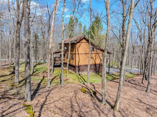 exterior space featuring a deck and a yard