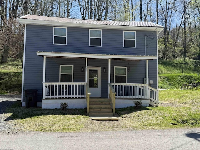 view of front of house featuring covered porch and metal roof