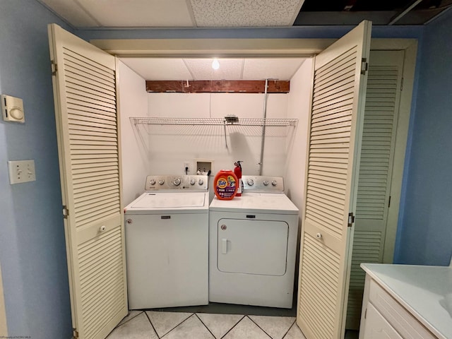 1223 Katherine St, Fairmont, WV 26554 - laundry area with light tile patterned floors, washing machine and clothes dryer, and laundry area