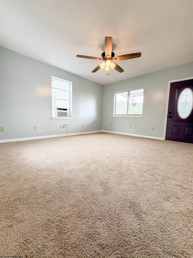 125 E Long St, Grafton, WV 26354 - carpeted empty room featuring baseboards, cooling unit, ceiling fan, and a wealth of natural light