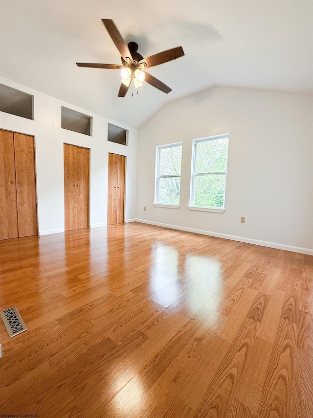 125 E Long St, Grafton, WV 26354 - unfurnished bedroom featuring lofted ceiling, light wood-style flooring, ceiling fan, visible vents, and two closets