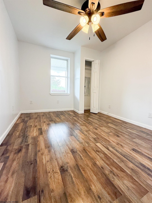 125 E Long St, Grafton, WV 26354 - unfurnished bedroom with a ceiling fan, hardwood / wood-style floors, and baseboards
