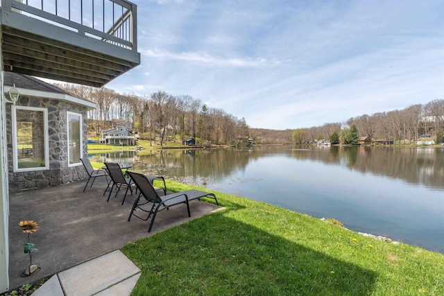 exterior space featuring a yard and a water view