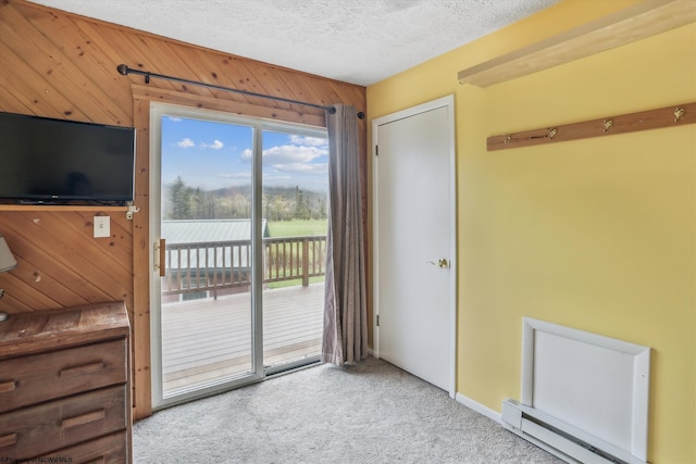 5570 Appalachian Hwy, Davis, WV 26260 - doorway featuring a textured ceiling, carpet flooring, a baseboard heating unit, and baseboards
