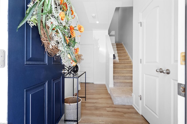 entryway featuring stairway, wood finished floors, recessed lighting, and baseboards