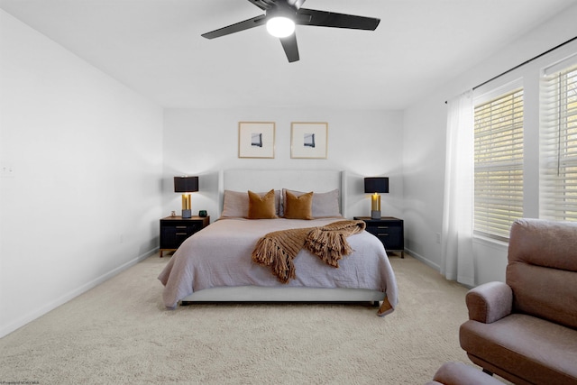 bedroom featuring a ceiling fan, carpet, and baseboards