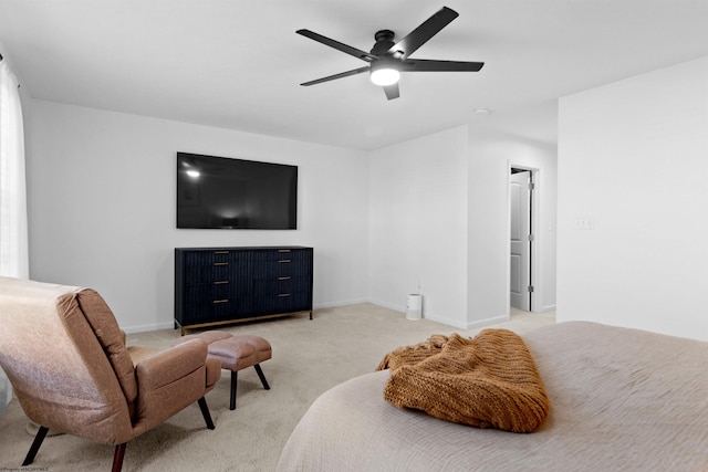 bedroom with baseboards, ceiling fan, and light colored carpet