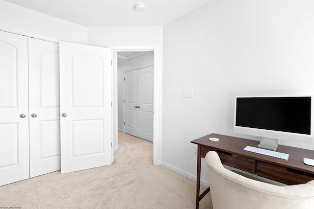 home office featuring light colored carpet and baseboards