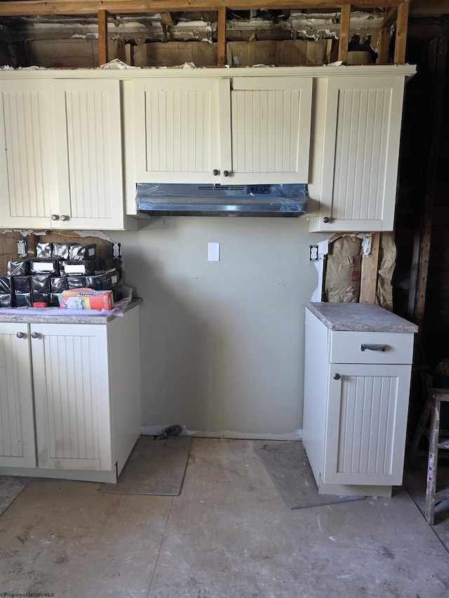 laundry room featuring baseboards