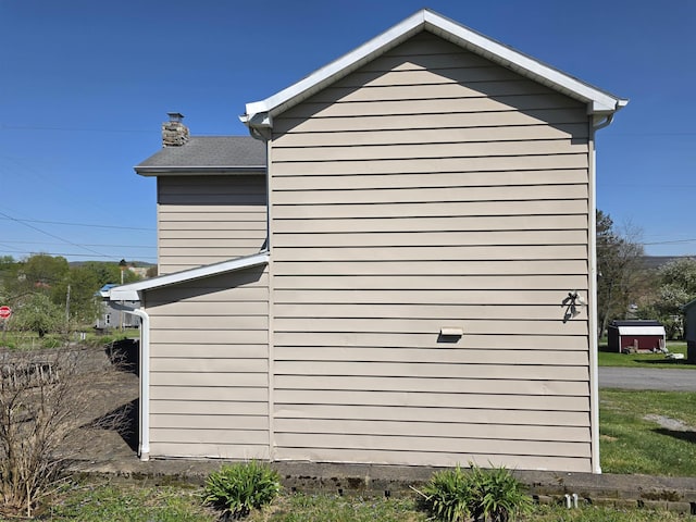 view of home's exterior with a chimney