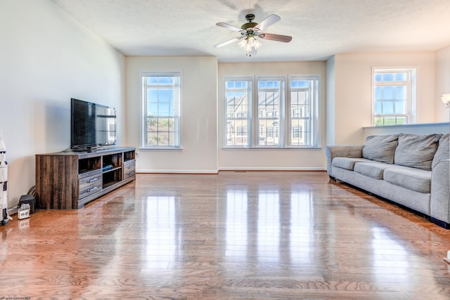3005 Sun Vw, Morgantown, WV 26505 - living area featuring a ceiling fan, baseboards, and a healthy amount of sunlight