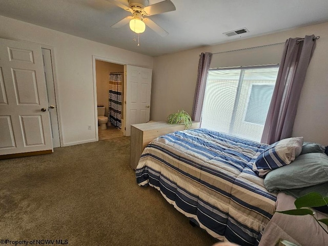 bedroom with carpet floors, a ceiling fan, ensuite bath, and visible vents