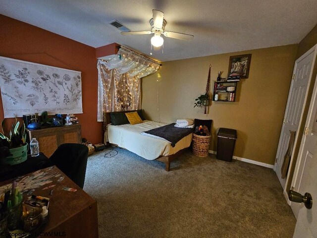 bedroom with carpet flooring, ceiling fan, visible vents, and baseboards