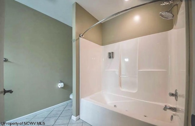 full bath featuring tub / shower combination, baseboards, tile patterned floors, and toilet