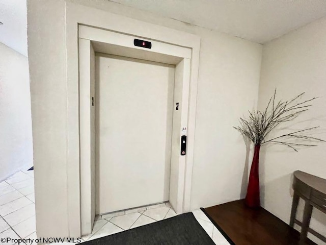 doorway to property featuring elevator