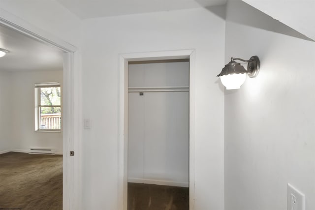 closet with a baseboard heating unit