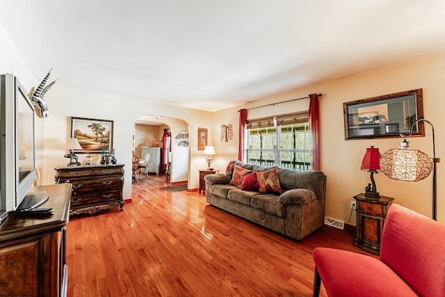 1252 Monumental Rd, Fairmont, WV 26554 - living area with visible vents, arched walkways, and wood finished floors