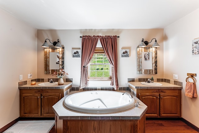 1252 Monumental Rd, Fairmont, WV 26554 - full bath featuring a whirlpool tub, two vanities, and a sink