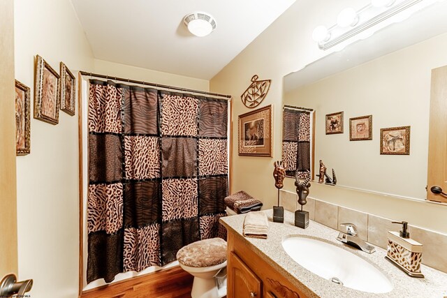1252 Monumental Rd, Fairmont, WV 26554 - bathroom featuring a shower with shower curtain, toilet, wood finished floors, and vanity