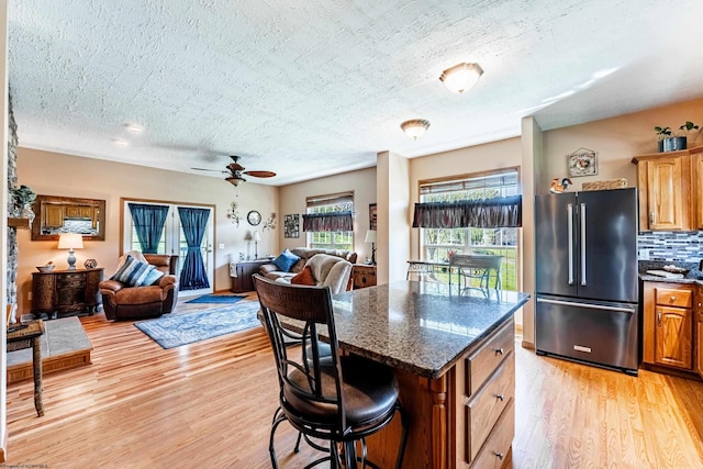 1252 Monumental Rd, Fairmont, WV 26554 - kitchen with high end refrigerator, light wood finished floors, and open floor plan