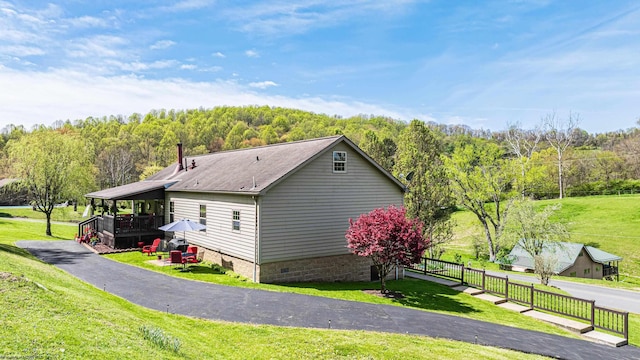 1252 Monumental Rd, Fairmont, WV 26554 - view of home's exterior featuring a lawn, a forest view, and crawl space
