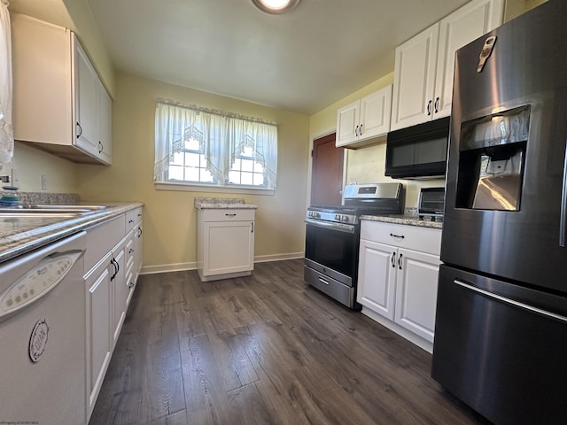kitchen with baseboards, dark wood-style floors, white cabinets, and stainless steel appliances