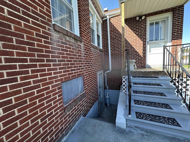 entrance to property with brick siding