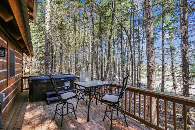 79 Pines Dr, Davis, WV 26260 - wooden terrace with outdoor dining area and a hot tub