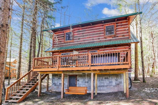 79 Pines Dr, Davis, WV 26260 - back of property featuring a garage, metal roof, a deck, and stairway