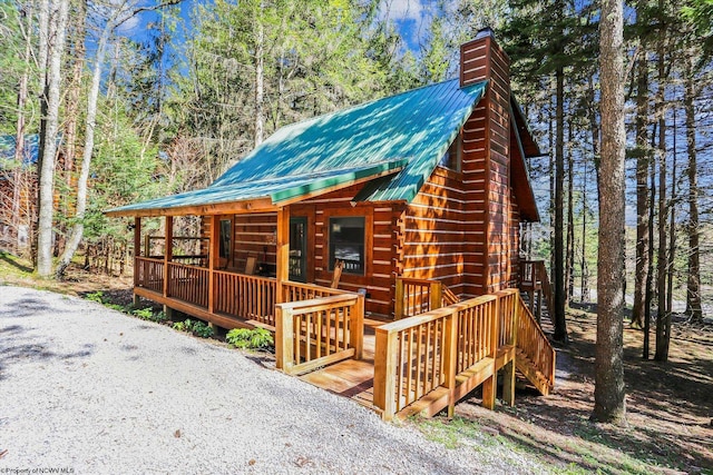 79 Pines Dr, Davis, WV 26260 - exterior space featuring a wooden deck, a chimney, and metal roof