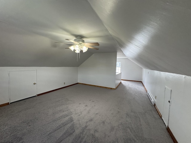 bonus room featuring vaulted ceiling, carpet floors, baseboards, and a ceiling fan