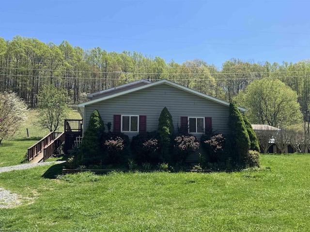 143 Sunday Dr, Fairmont, WV 26554 - view of side of property with a yard and a wooded view